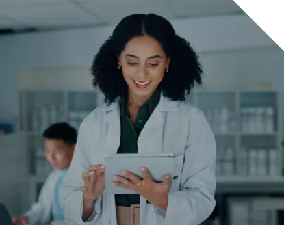 Female medical staff smiling and taking notes